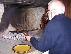 Joerg grilling steaks in the fireplace