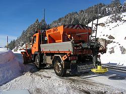 Snow plow on the pass road