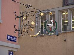 Wrought-iron sign of a very old hotel