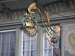 The iron sign of the old restaurant on Central Square